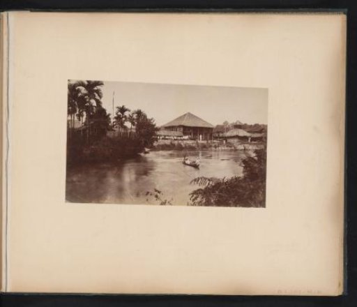 European man in a boat on a river
