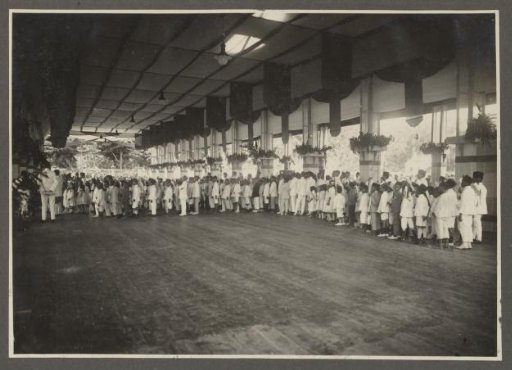Rows of people in the reception hall of the palace of the Sultan of Langkat