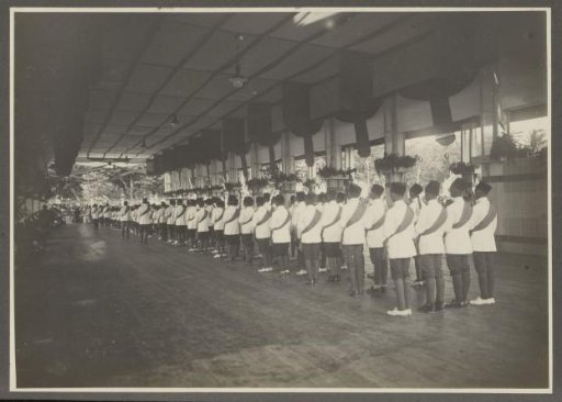 Row of paramilitaries in the reception hall in the palace of the Sultan of Langkat
