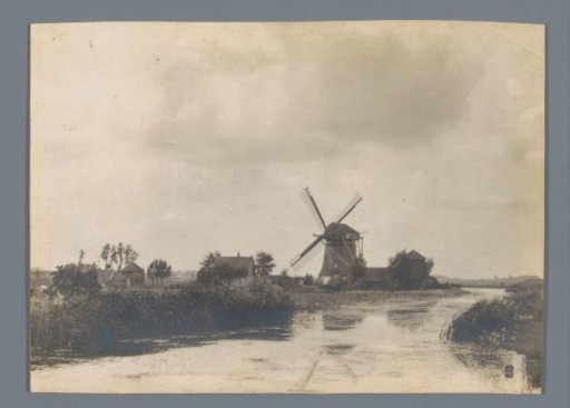 View of a mill and farms along a river, Netherlands