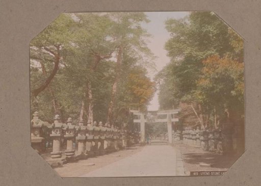 Stone lanterns along a path in a park in Ueno, Tokyo, Japan