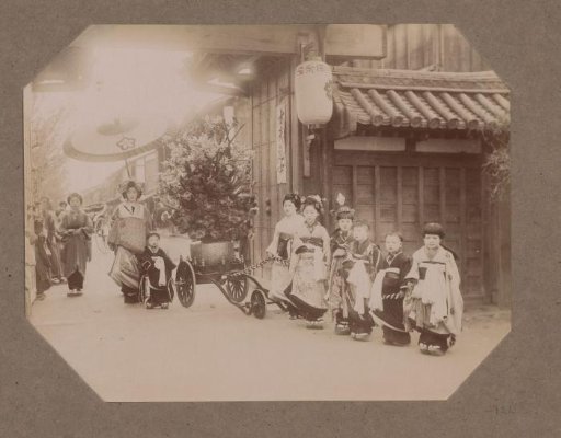 Children on the street with a bouquet of flowers on a cart, Japan
