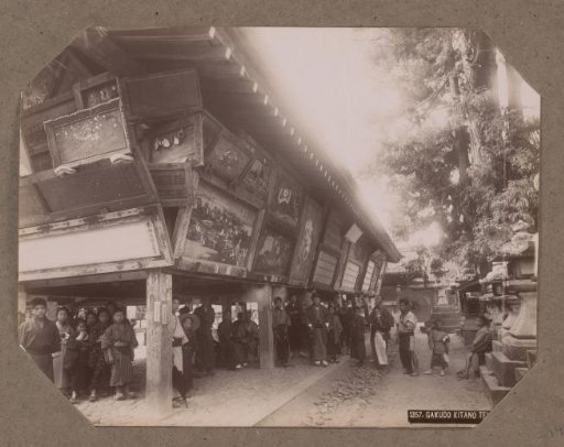 Group of men at the Kitano Tenmangu temple in Kyoto, Japan