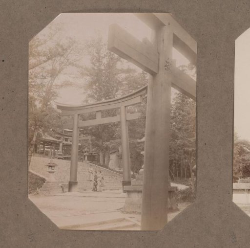 View of a torii on a square, presumably part of a temple complex, Japan