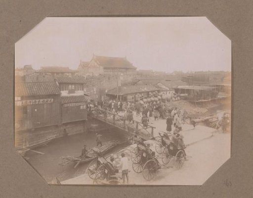 View of a Street with Rickshaws and a Pottery in China