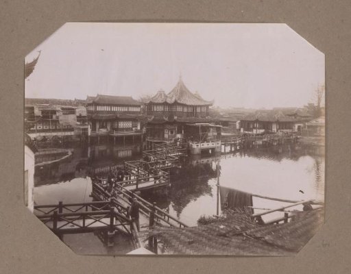 View of Houses on Piles over Water in China