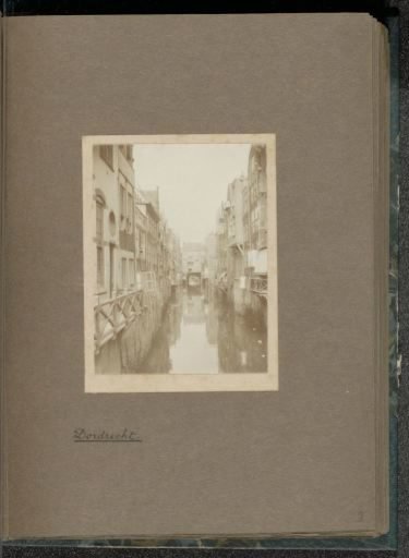 View through the Voorstraatshaven in Dordrecht with the covering of the Scheffersplein in the background