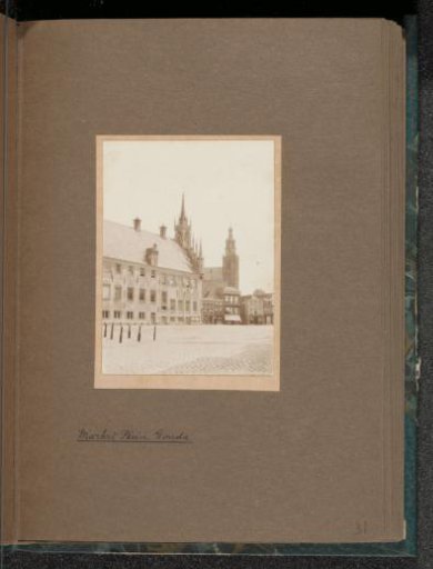 Market square of Gouda with the town hall on the left and the Great Church on the right