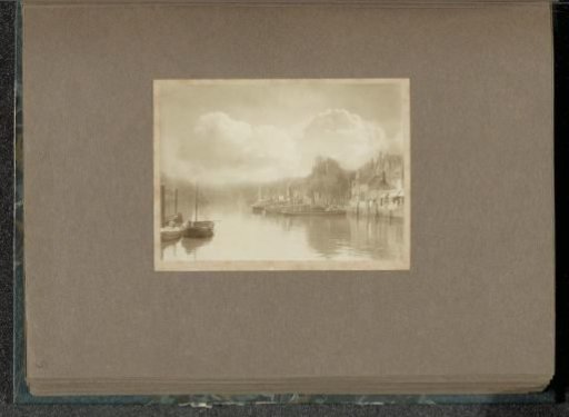 View of the Wijnhaven in Dordrecht with the Sint-Bonifatius Church in the background under a cloudy sky