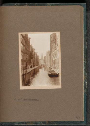 Houses on the Oudezijds Kolk in Amsterdam with the tower of the Oude Kerk in the background