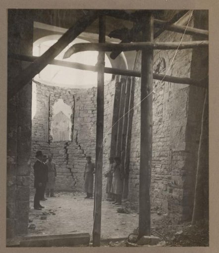 Group of workers under a partially collapsing vault