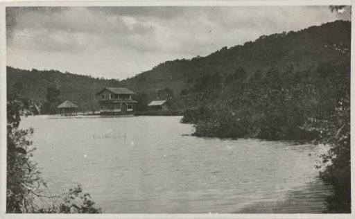 River landscape with a view of a house