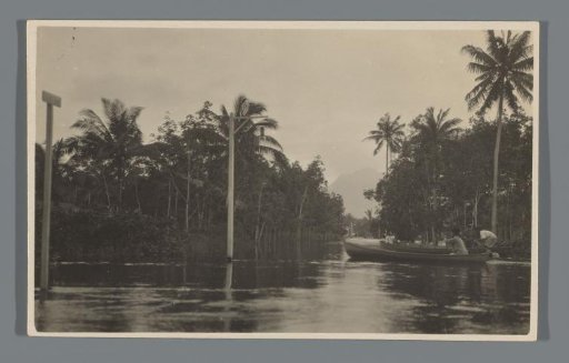 Boats navigating the flooded streets of Singkawang