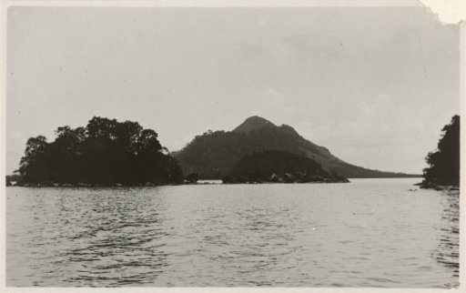 View of a mountain situated in the water in Singkawang