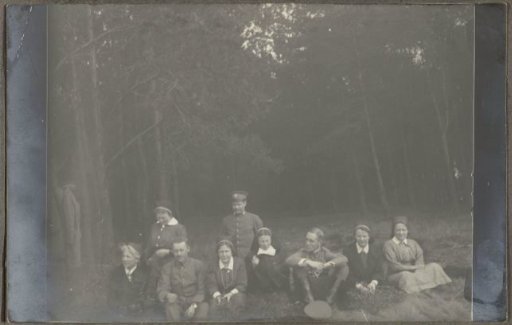 Group portrait of nurses and men in uniform in the woods