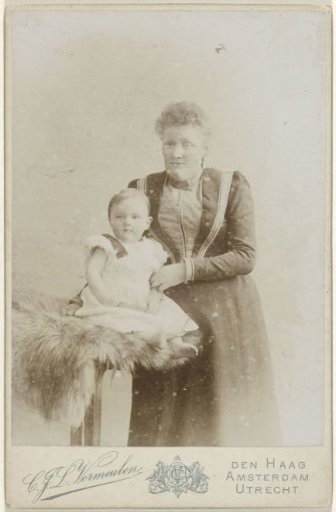 Studio portrait of mother with baby daughter