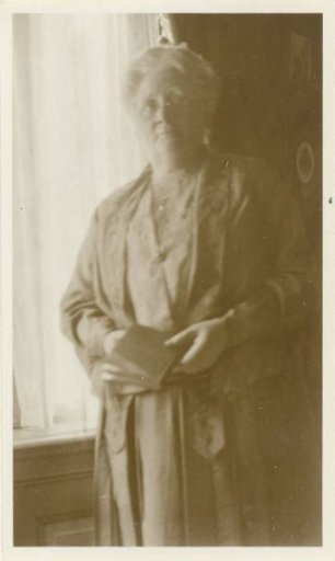 Portrait of Grietje Vermeulen with a book