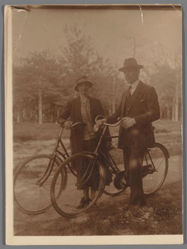 Man and Woman Standing with a Bicycle