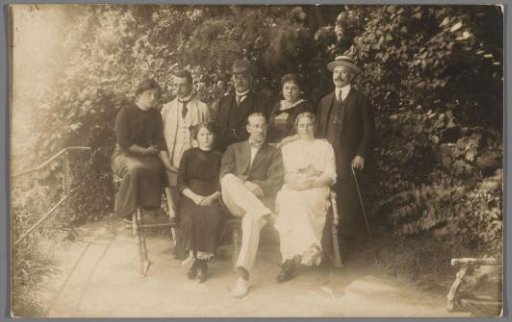 Family portrait of unknown people in a park or garden