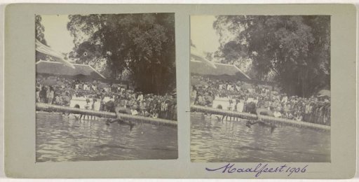 Boy Crawling Over a Horizontal Pole During the Maalfeest