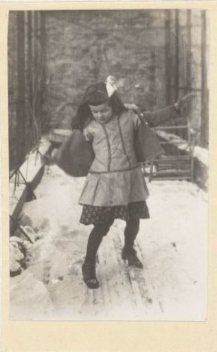 Marba Titzenthaler, daughter of the photographer, sliding on the snow on the roof terrace of the residence on Friedrichstrasse, Berlin