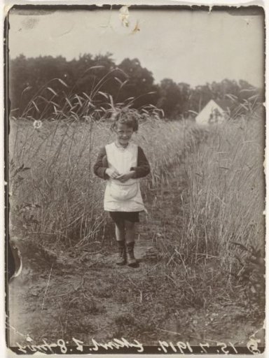 Eckart Titzenthaler, son of the photographer, standing in a field