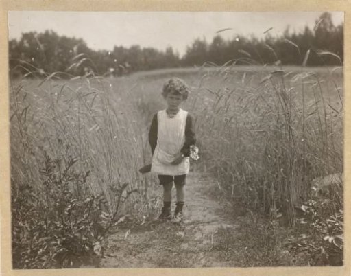 Eckart Titzenthaler, son of the photographer, standing in a field