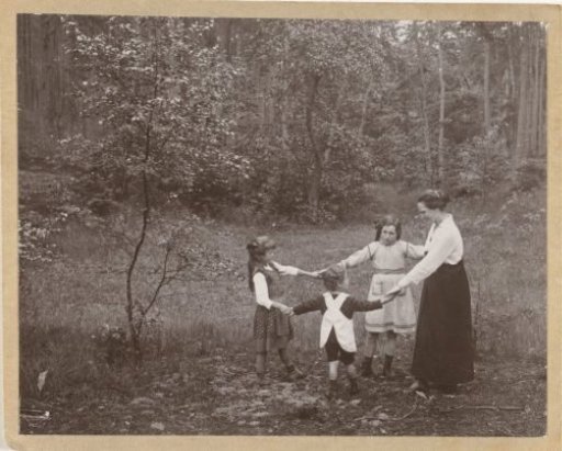 Marba and Eckart Titzenthaler, children of the photographer, and an unknown girl and an unknown woman dancing in a forest