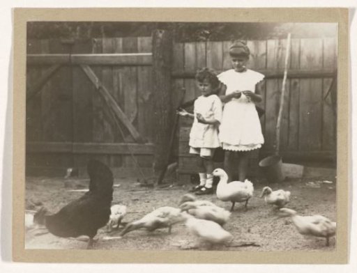 Marba and Eckart Titzenthaler, children of the photographer, on a farmyard with chickens and ducks