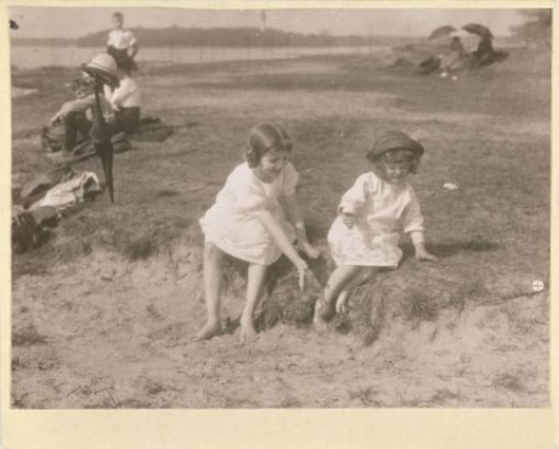 Marba Titzenthaler, daughter of the photographer, and an unknown girl playing on the shore of a lake