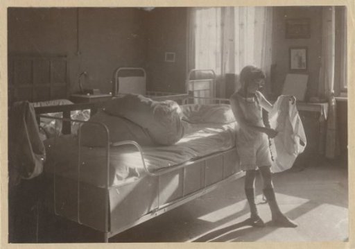 Marba Titzenthaler, daughter of the photographer, in the bedroom of the residence on Friedrichstrasse, Berlin