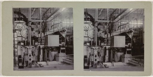 Two men standing next to machines in a sugar factory (?) Soemberkareng
