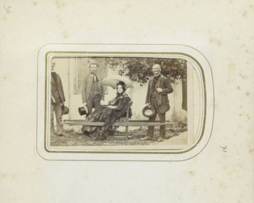 Three men and a woman in a sedan chair in Ischl