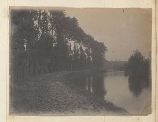 River with a towpath along a forest edge