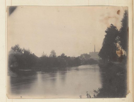 View of a river with houses, church and bridge