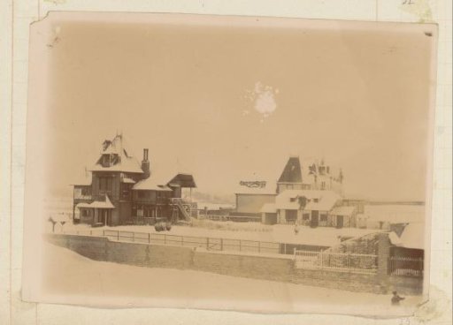 Walled complex of half-timbered houses in the snow