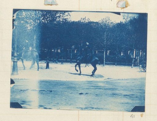 Men in uniform on horseback in a park