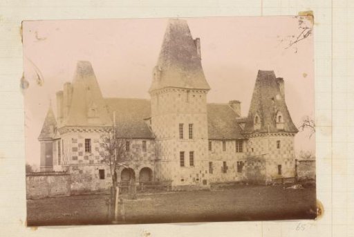 Exterior of a castle with towers and checkered masonry