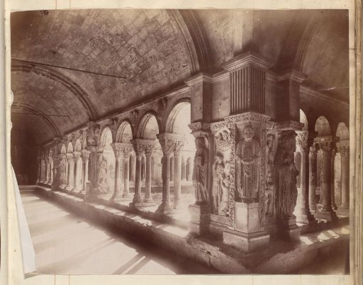 Colonnade with statues and reliefs, presumably at a monastery or church