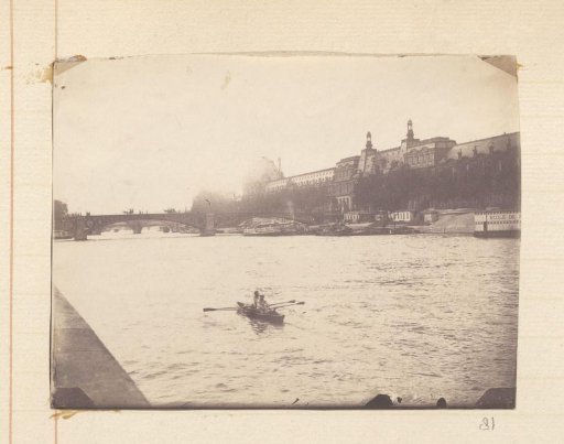Rowing boat with two men on the Seine in Paris
