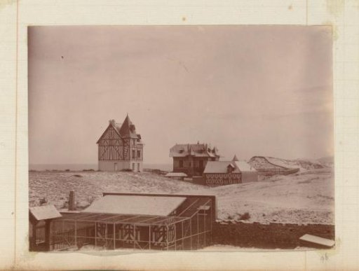 Snow-covered half-timbered houses on a coast