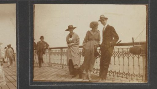 Two women and a man on the pier in Scheveningen