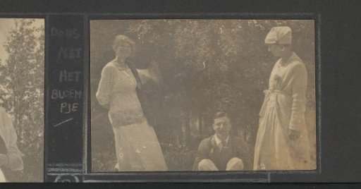 Two Standing Women and a Seated Man