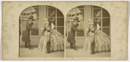 Man bidding farewell to a woman with a child