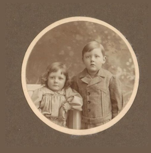 Portrait of a Standing Boy and a Sitting Girl