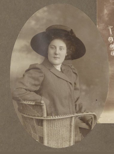 Portrait of a Seated Woman with a Long Coat and a Hat