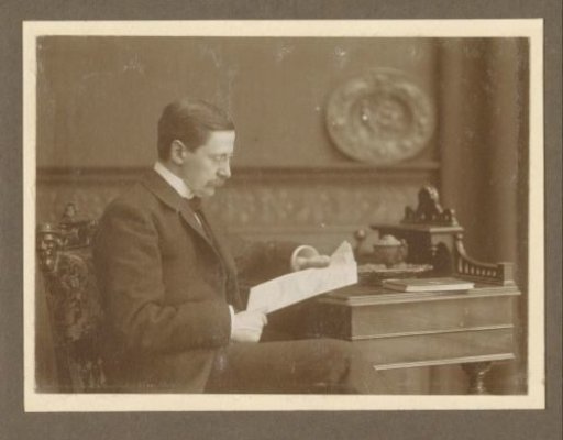 Portrait of Photographer C.J.L. Vermeulen with a Newspaper