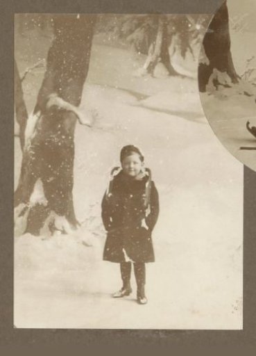 Portrait of a boy with skates around his neck