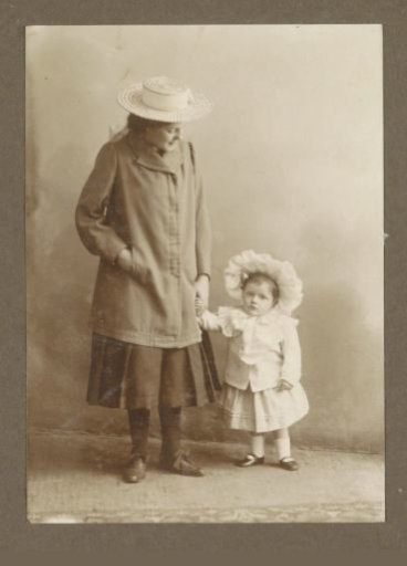 Portrait of a woman with a small child by the hand