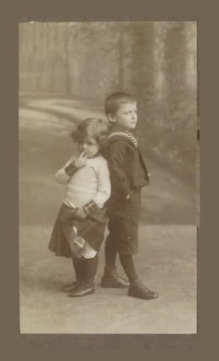 Portrait of two Vermeulen children standing back to back